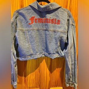 Cute Cropped Denim Jacket with “Feminista” on back.